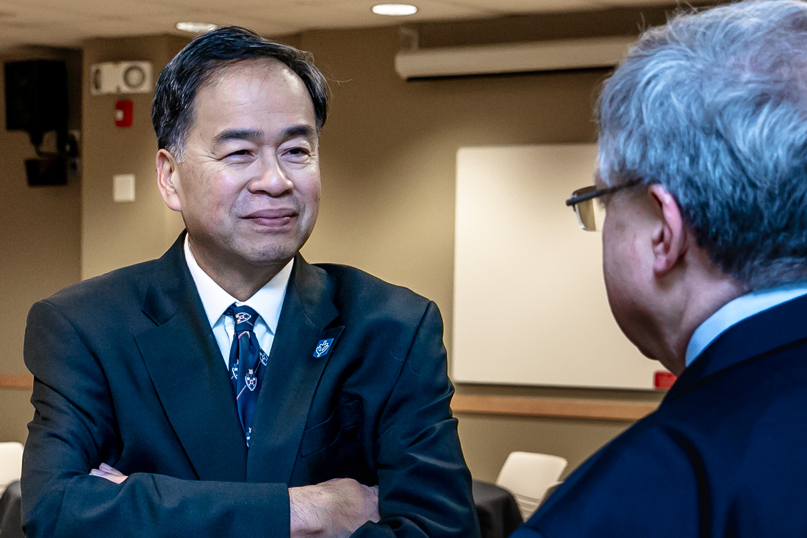 A. Gabriel Esteban, Ph.D., president of DePaul, left, converses with Eric Zarnikow, executive director of the Illinois Student Assistance Commission, during an informal luncheon held prior to the board meeting. (DePaul University/Randall Spriggs)